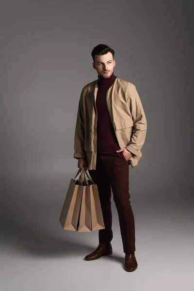Full Length Stylish Man Autumn Outfit Holding Shopping Bags Grey — Fotografia de Stock