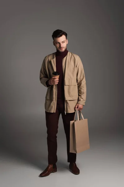 Full Length Trendy Man Autumn Outfit Holding Coffee Shopping Bag — Stock Photo, Image