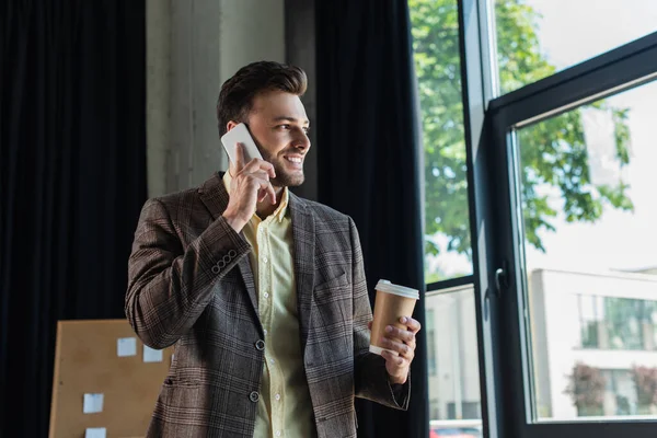 Positive Businessman Holding Coffee Talking Cellphone Office — Foto Stock