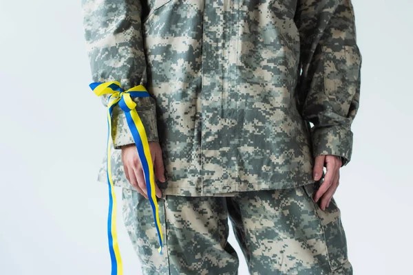 Cropped View Soldier Uniform Blue Yellow Ribbon Hand Isolated Grey — Stockfoto