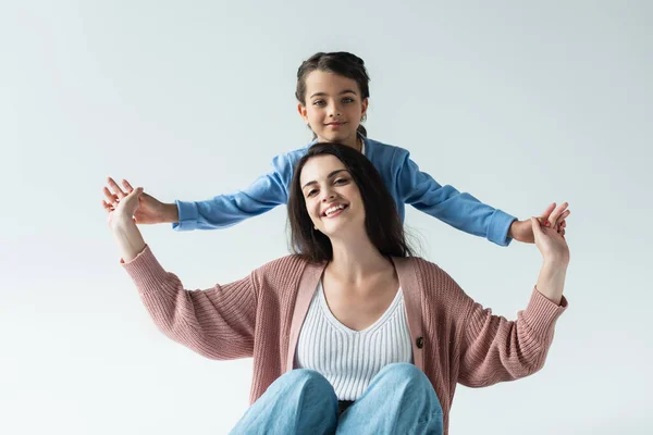 Cheerful Mom Daughter Holding Hands Smiling Camera Isolated Grey — Stockfoto