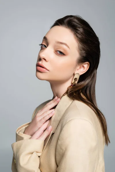 Sensual Young Woman Beige Blazer Looking Camera Isolated Grey — стоковое фото