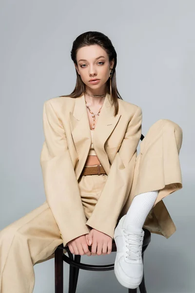 Brunette Young Woman Stylish Outfit Posing Wooden Chair Isolated Grey — стоковое фото