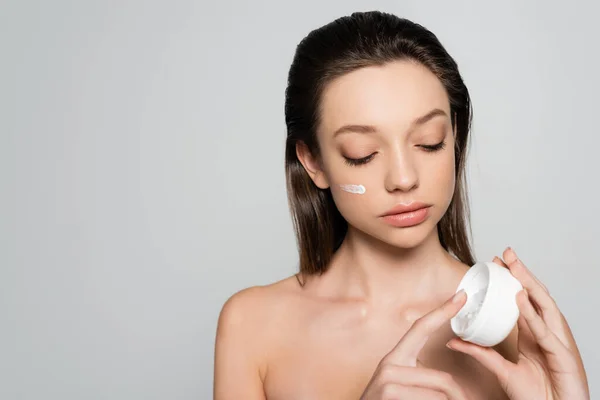 Young Woman Bare Shoulders Cream Face Looking Container Isolated Grey — Zdjęcie stockowe