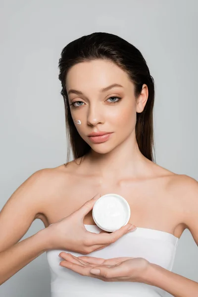 Brunette Young Woman Bare Shoulders Cream Cheeks Holding Container Isolated — Φωτογραφία Αρχείου