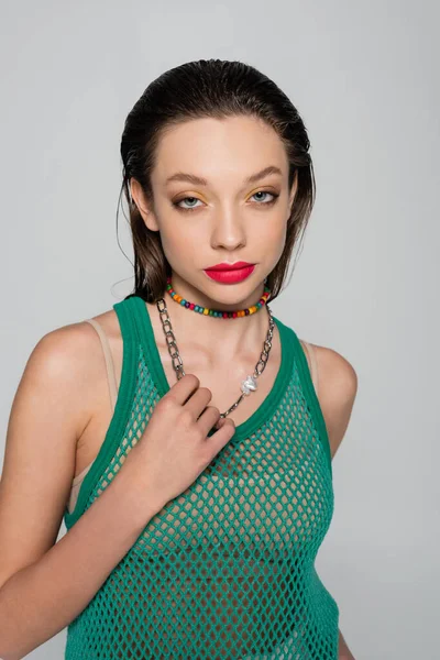 Stylish Woman Green Tank Top Colorful Necklace Pulling Chain Isolated — ストック写真
