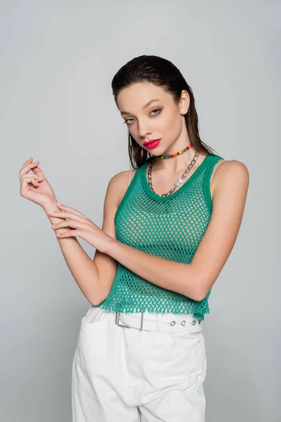 Trendy Woman Green Tank Top Colorful Necklace Posing Isolated Grey — Zdjęcie stockowe