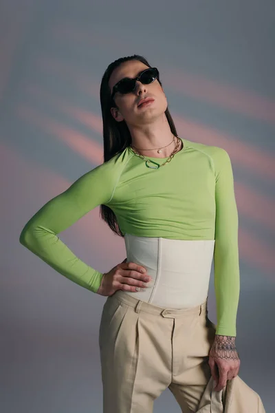 Brunette Queer Model Sunglasses Corset Standing Abstract Background — ストック写真