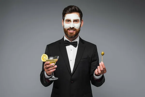 Happy Man Suit Clay Mask Face Holding Cocktail Toothpick Olive — Zdjęcie stockowe