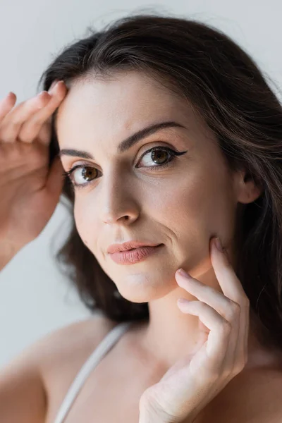 Portrait Brunette Woman Touching Face Isolated Grey — Photo