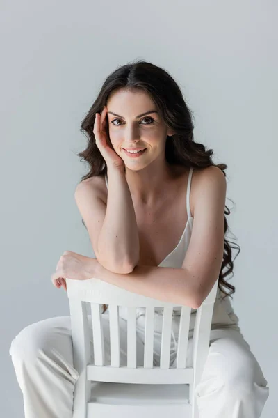 Pretty Brunette Model Sitting Chair Isolated Grey — 스톡 사진