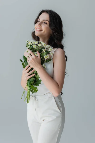 Cheerful Woman Holding Bouquet Looking Away Isolated Grey — Stockfoto