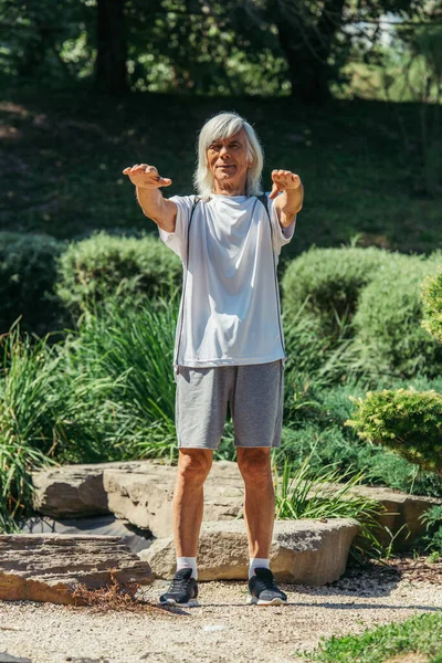 Full Length Cheerful Senior Man Grey Hair Exercising Outstretched Hands — Stock Photo, Image