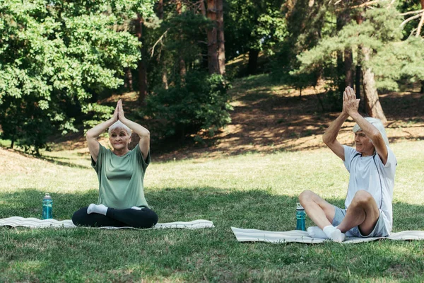 Senior Couple Sitting Yoga Pose Praying Hands Heads Practicing Fitness — Stock Photo, Image