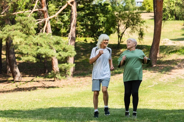 Full Length Senior Couple Sportswear Running Green Park — Stock Photo, Image