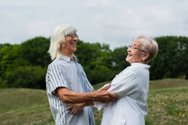 Happy Senior Couple Grey Hair Looking Each Other Smiling — Stockfoto