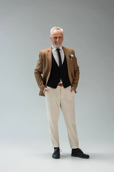 Full Length Happy Middle Aged Groom Suit Standing Hands Pockets — Fotografia de Stock