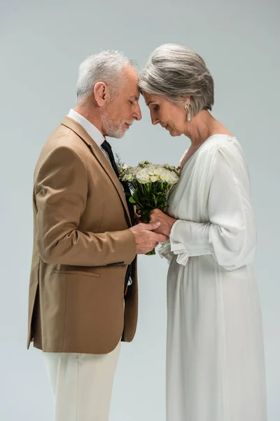 Side View Middle Aged Groom Bride White Dress Holding Hands — Fotografia de Stock