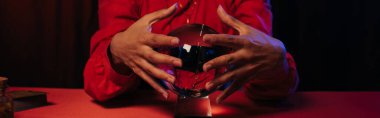 cropped view of predictor near crystal ball isolated on black, banner