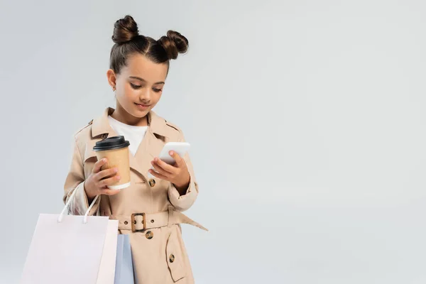 Cute Girl Trench Coat Holding Paper Cup Shopping Bags While — Stock Photo, Image