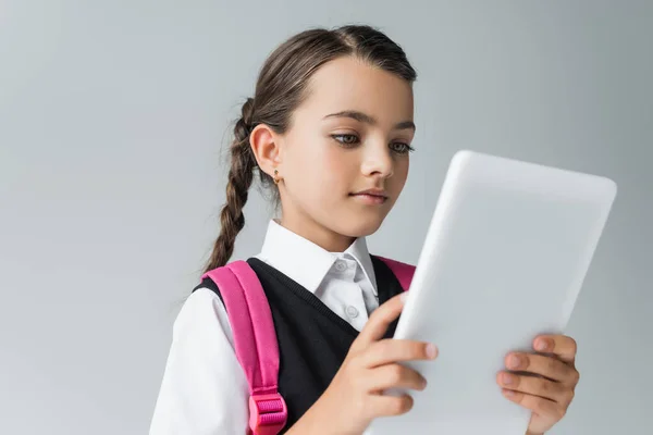 Cute Girl School Uniform Backpack Using Digital Tablet Isolated Grey — стоковое фото