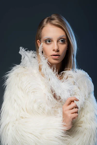 Young Woman Faux Fur Jacket Holding White Feather While Looking — Stock Photo, Image