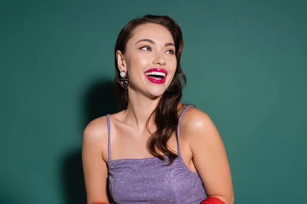 Happy Young Woman Wavy Hair Laughing While Looking Away Green — Stock Photo, Image