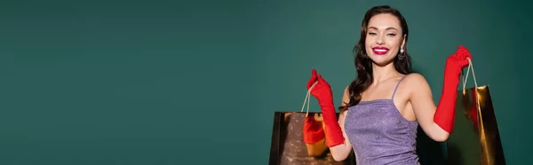 Happy Young Woman Red Gloves Purple Dress Holding Shopping Bags — Stock Photo, Image