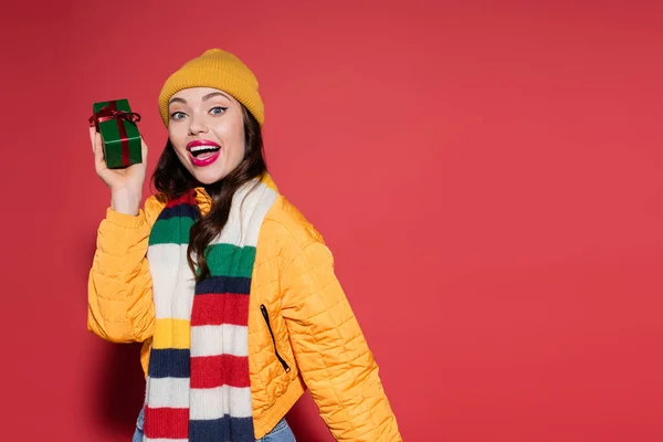 Excited Woman Beanie Hat Scarf Holding Wrapped Gift Box Red — Stock Photo, Image