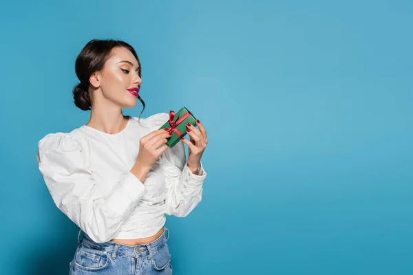 Happy Young Woman White Blouse Looking Wrapped Present Blue — Stock Photo, Image