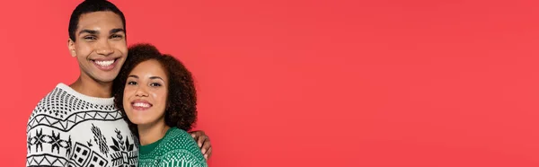 Cheerful African American Man Embracing Girlfriend Looking Camera Isolated Red — Stock Photo, Image