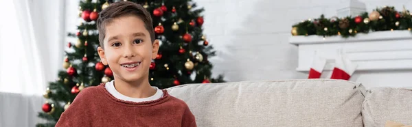 Joyful Boy Teeth Brackets Smiling Camera Christmas Tree Blurred Background — Stock Photo, Image