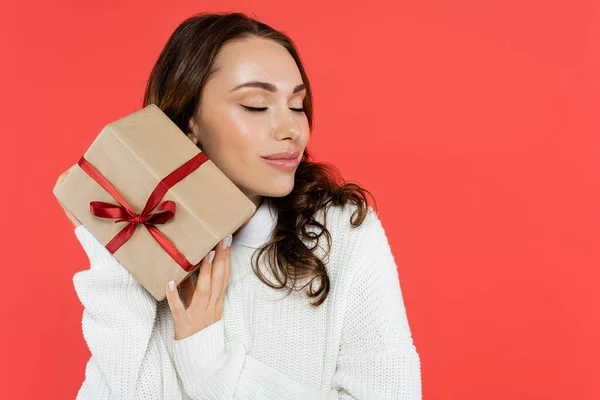 Pretty Brunette Woman Cozy Sweater Holding Gift Closing Eyes Isolated — Stock Photo, Image