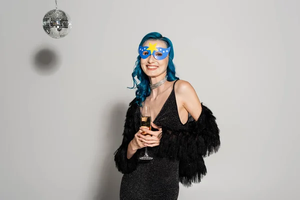 Woman Elegant Clothes Party Mask Holding Champagne Looking Camera Grey — Stock Photo, Image