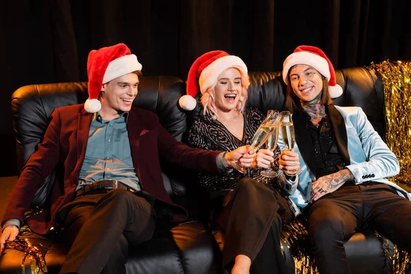 Excited Nonbinary Friends Santa Hats Clinking Champagne Glasses White Celebrating — Stock Photo, Image