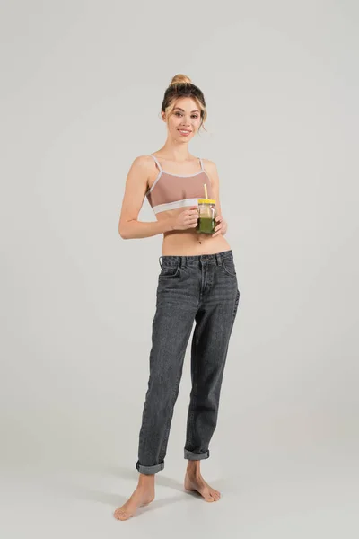 Full Length Happy Barefoot Woman Sports Top Jeans Standing Jar — Stock Photo, Image