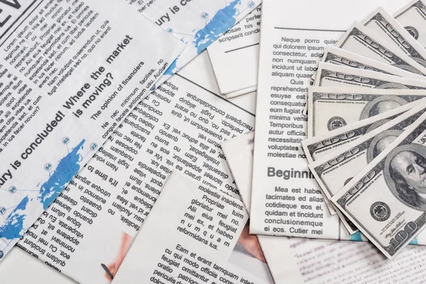 Top view of dollar banknotes on newspapers — Stock Photo