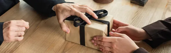Cropped view of client giving gift box to judge, anti-corruption concept, banner — Stock Photo
