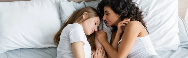 Top view of lesbian couple sleeping together in bed, banner — Stock Photo