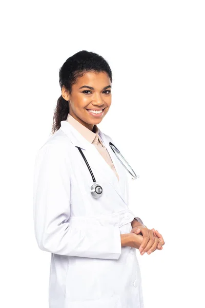 Smiling african american doctor looking at camera isolated on white — Stock Photo