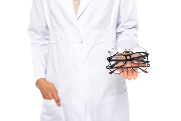 Cropped view of african american doctor holding eyeglasses isolated on white — Stock Photo