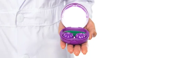 Container with contact lenses on hand of african american doctor isolated on white, banner — Stock Photo