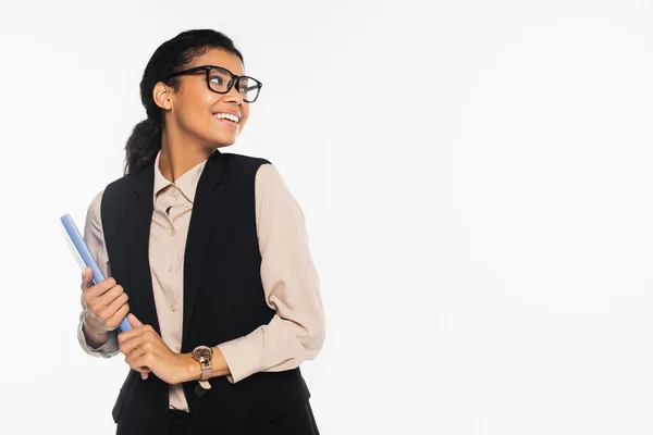 Happy african american businesswoman in eyeglasses holding paper folder isolated on white — Stock Photo