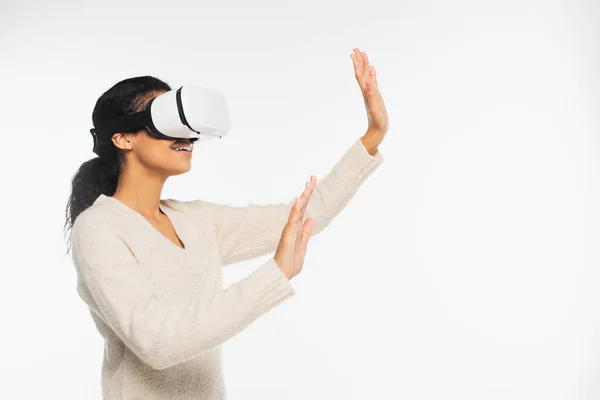 African american woman showing stop gesture while using vr headset isolated on white — Stock Photo