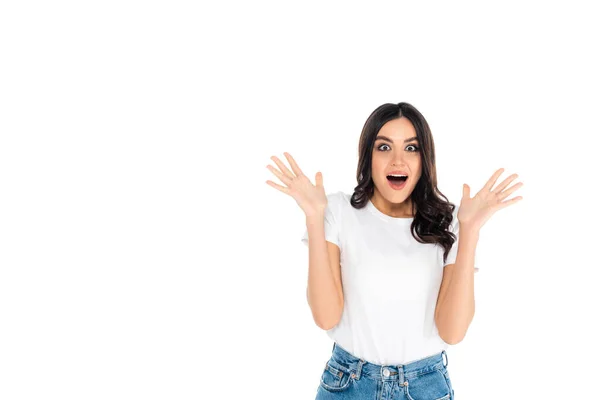 Astonished woman in t-shirt showing wow gesture isolated on white - foto de stock