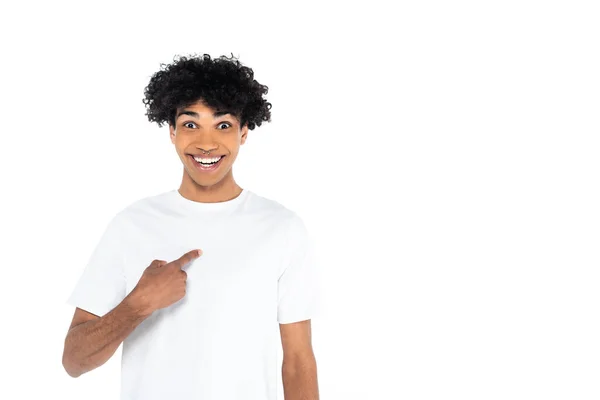 Surprised and happy african american man looking at camera and pointing with finger at himself isolated on white — Stock Photo