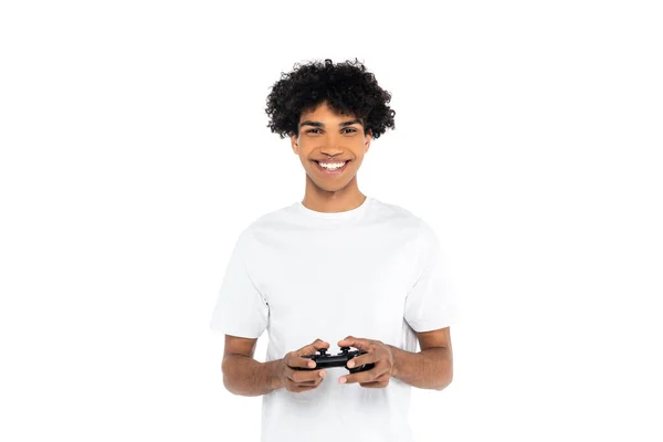 KYIV, UKRAINE - APRIL 10, 2020: joyful african american man playing video game isolated on white — стокове фото