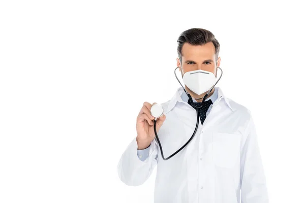 Doctor in white coat and medical mask holding stethoscope isolated on white — Fotografia de Stock