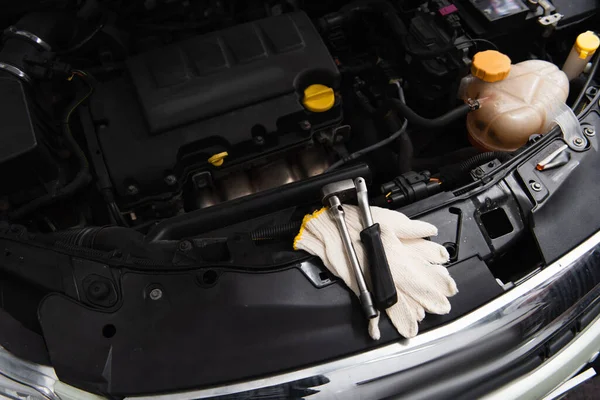 Top view of tools and gloves on car in service — Stock Photo