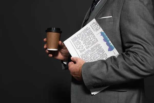 Partial view of businessman with newspaper and takeaway drink on dark grey — Photo de stock